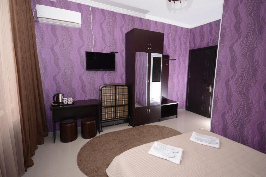 TV a/nebo společenská místnost v ubytování Hotel Like