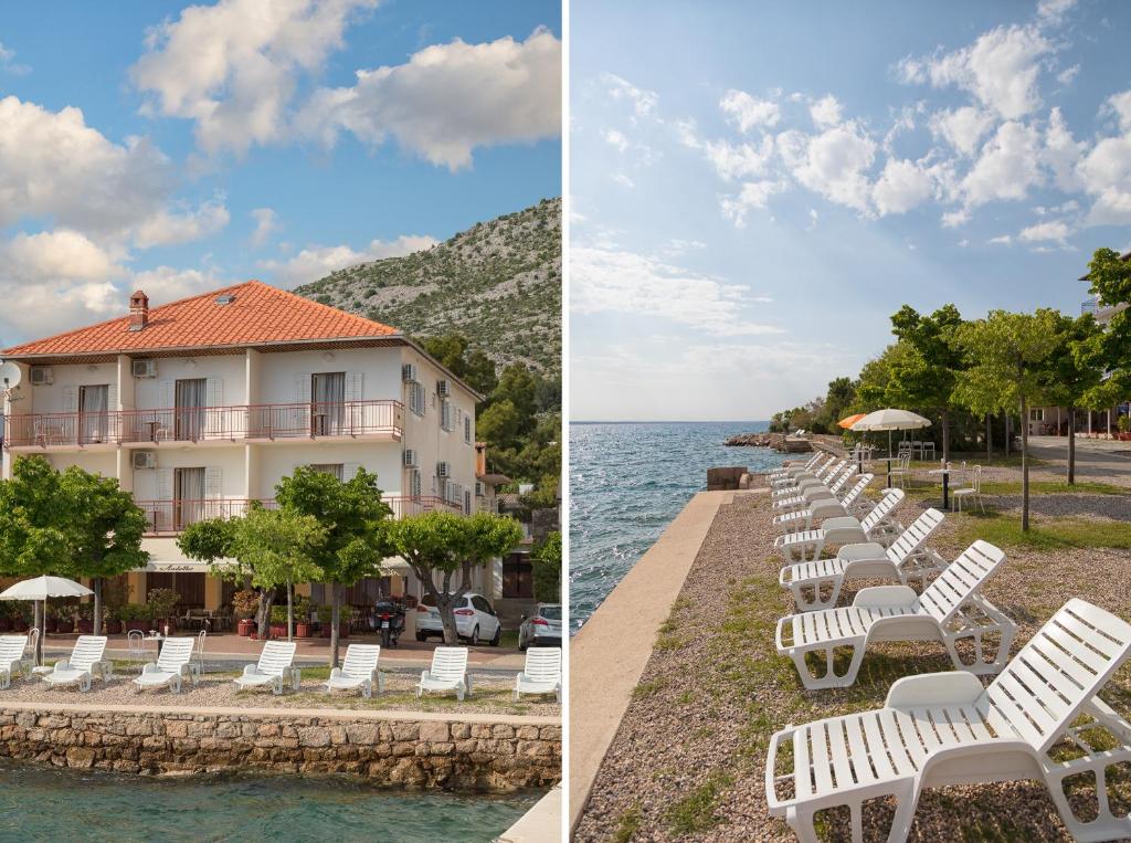 a row of white lawn chairs next to the water at Pansion Anđelko in Starigrad-Paklenica