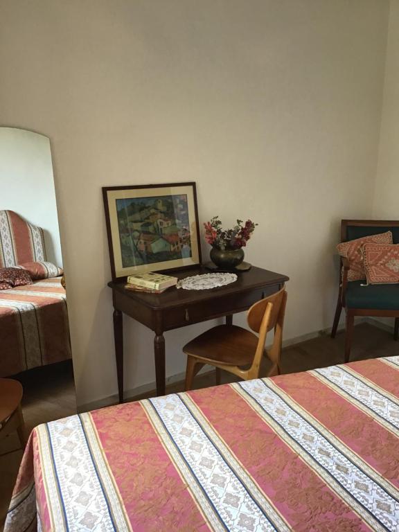 Postel nebo postele na pokoji v ubytování L’Arco
