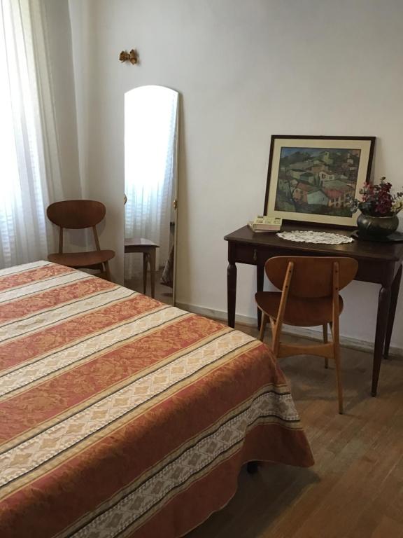 Postel nebo postele na pokoji v ubytování L’Arco