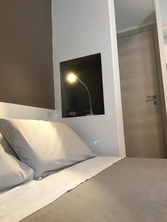 Łóżko lub łóżka w pokoju w obiekcie La Maggiolina camere La Spezia