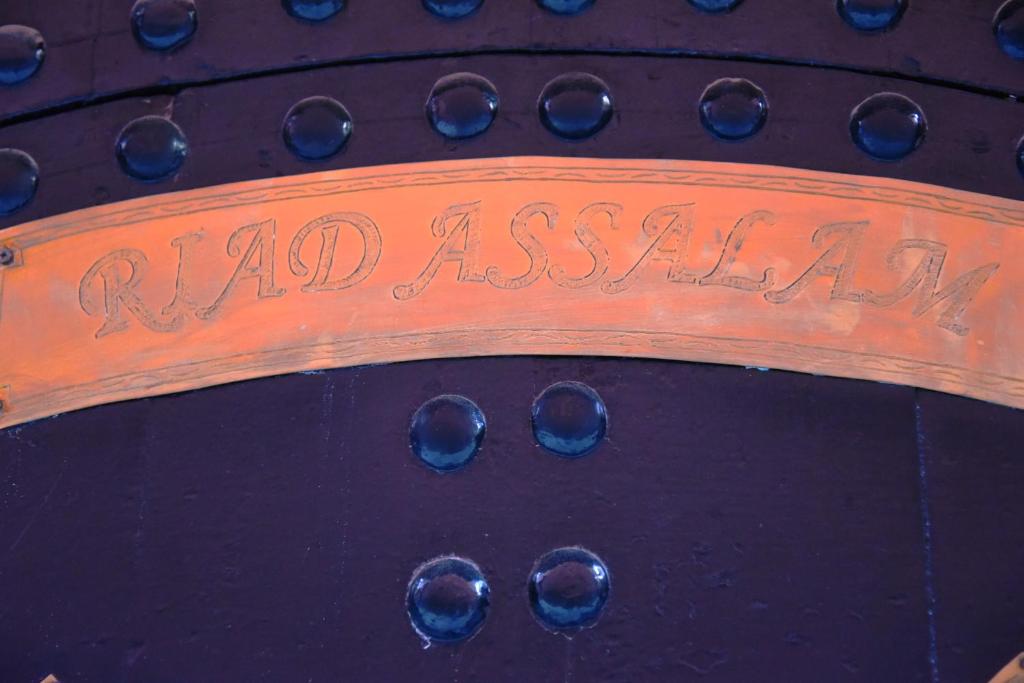 a sign that says raja ashiana with olives on it at Riad Assalam in Marrakech