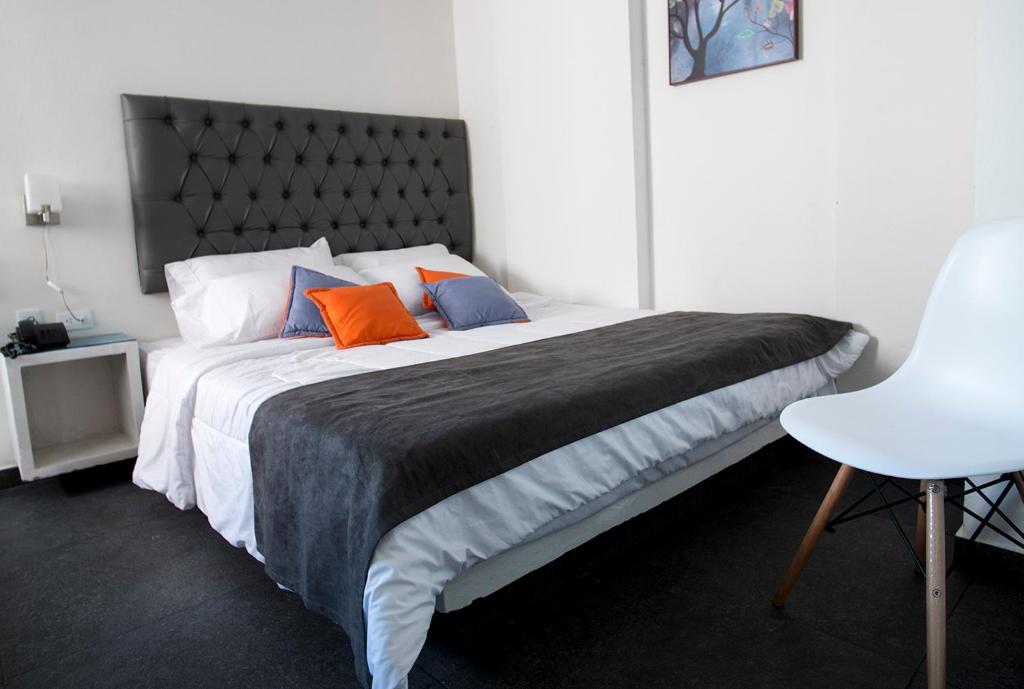 Postel nebo postele na pokoji v ubytování Hotel Grand H&R