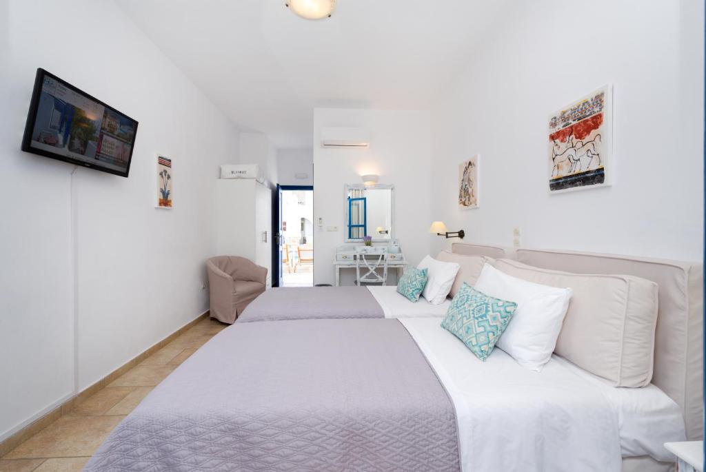 Postel nebo postele na pokoji v ubytování Hotel Mathios