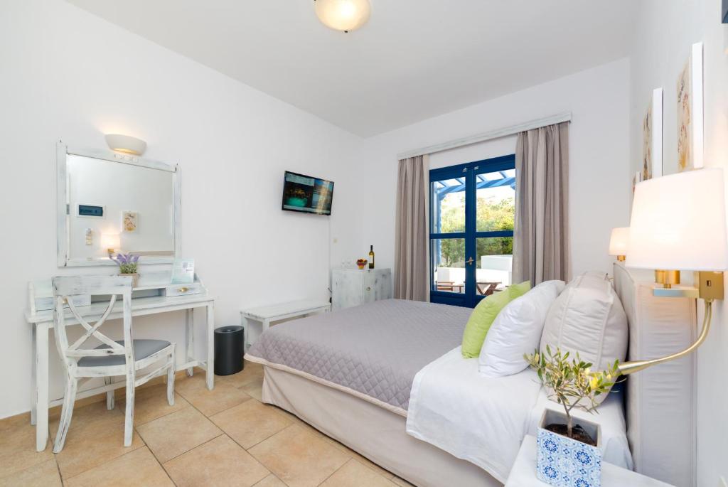 Postel nebo postele na pokoji v ubytování Hotel Mathios