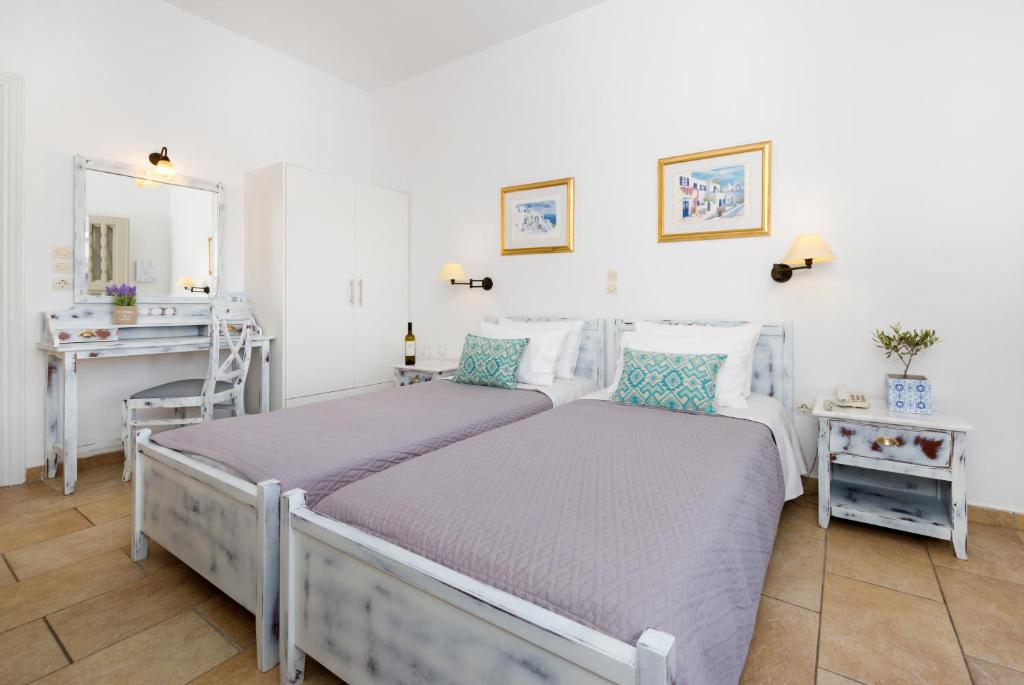 Postel nebo postele na pokoji v ubytování Hotel Mathios