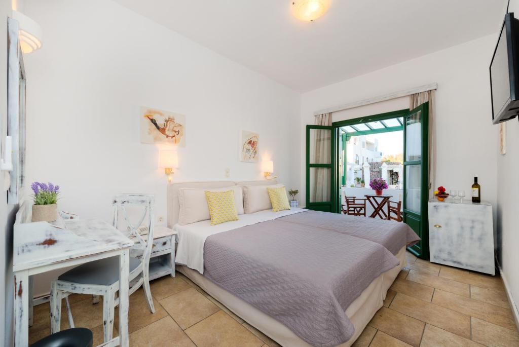 Postel nebo postele na pokoji v ubytování Hotel Mathios
