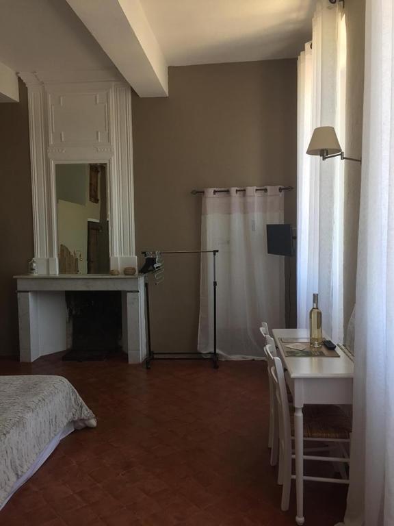Postel nebo postele na pokoji v ubytování Le Temps d'un Rêve