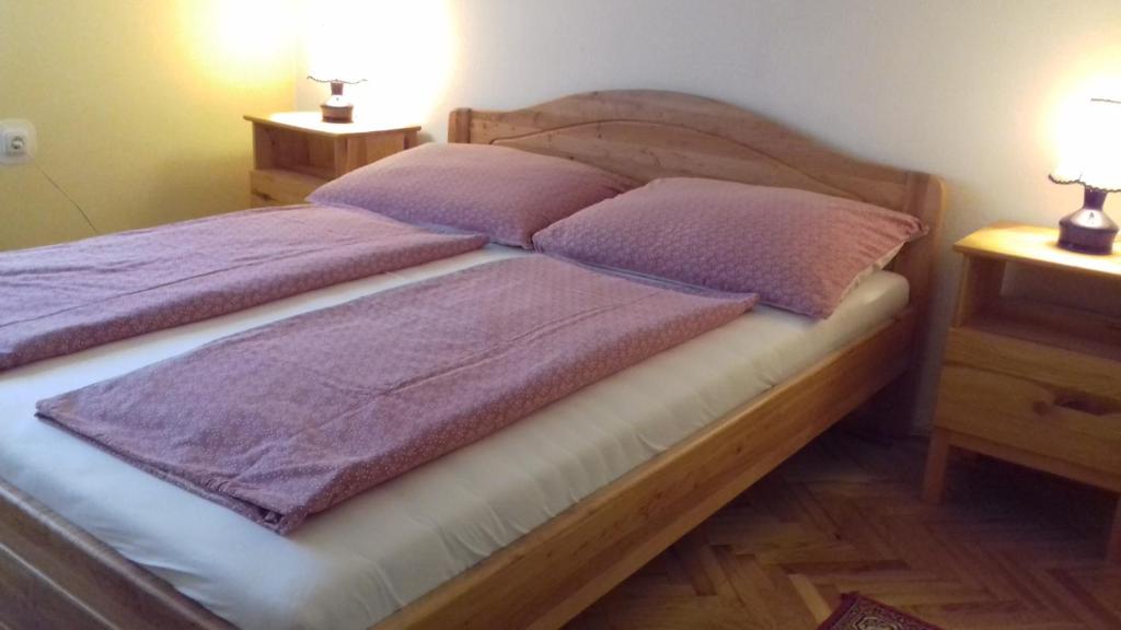Postel nebo postele na pokoji v ubytování Tiszafa Apartman