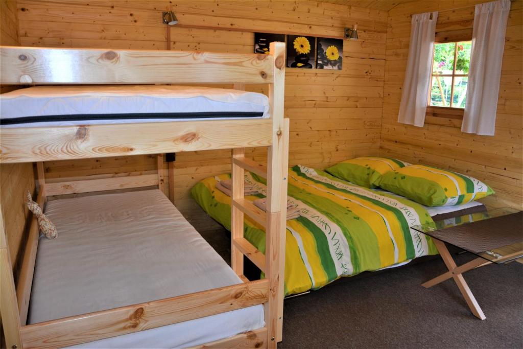 Postel nebo postele na pokoji v ubytování Rekreačná chatka Oliver