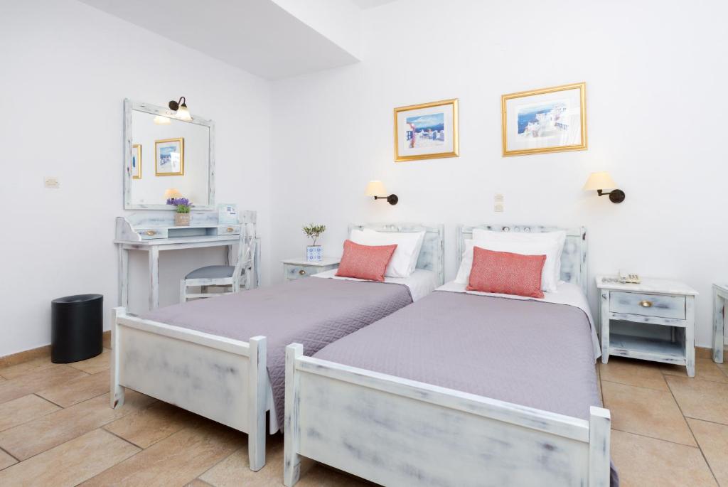 Postel nebo postele na pokoji v ubytování Hotel Mathios