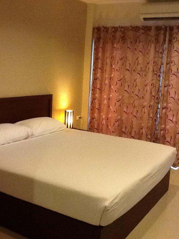 Postel nebo postele na pokoji v ubytování Kong Garden View Resort Chiang Rai