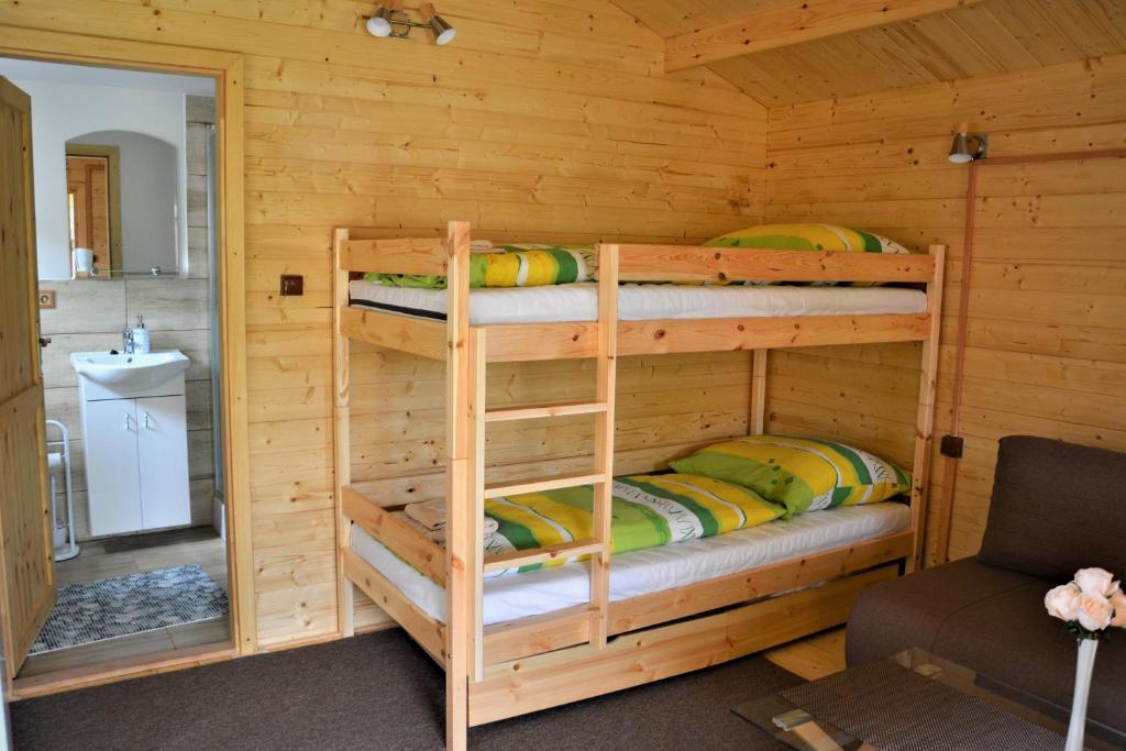 Postel nebo postele na pokoji v ubytování Rekreačná chatka Oliver
