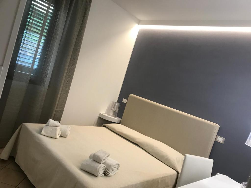 Postel nebo postele na pokoji v ubytování B&B Timpe Bianche