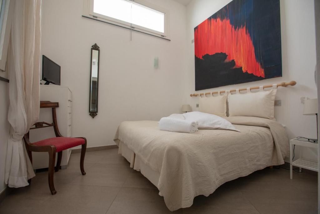 Postel nebo postele na pokoji v ubytování Il Gabbiano Relais in Stromboli