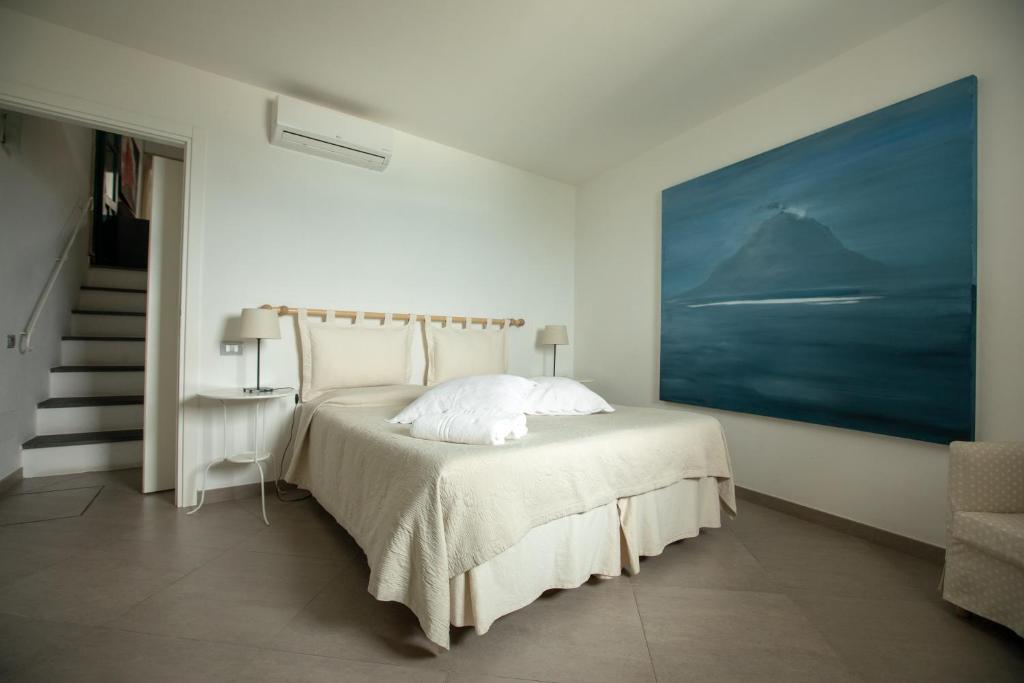 Postel nebo postele na pokoji v ubytování Il Gabbiano Relais in Stromboli