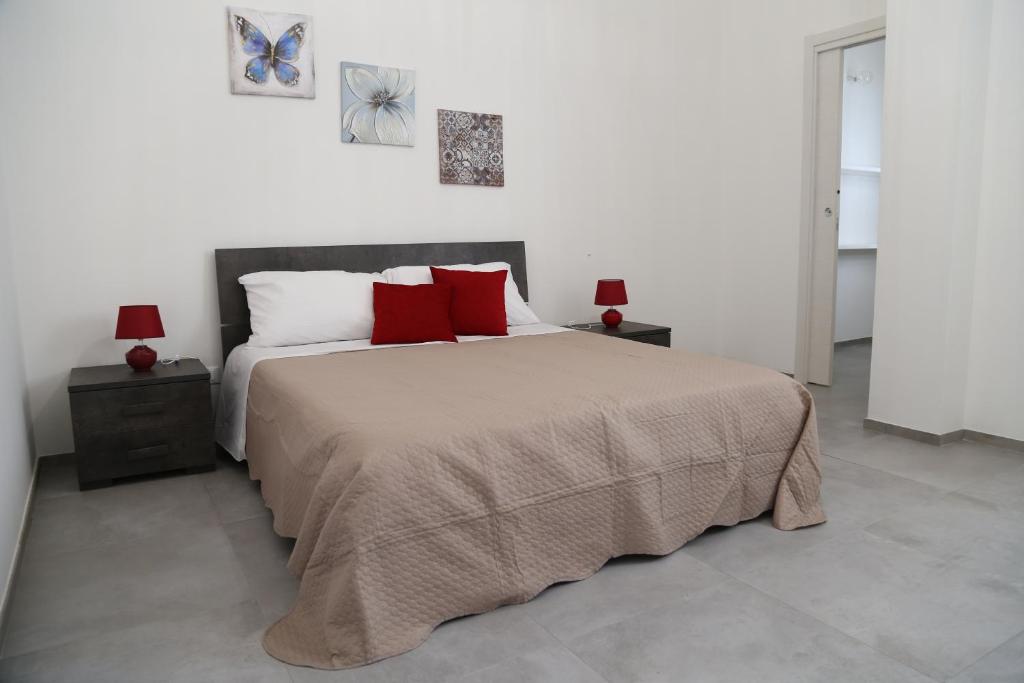 Ένα ή περισσότερα κρεβάτια σε δωμάτιο στο Casa Vacanza Nonno Pippi