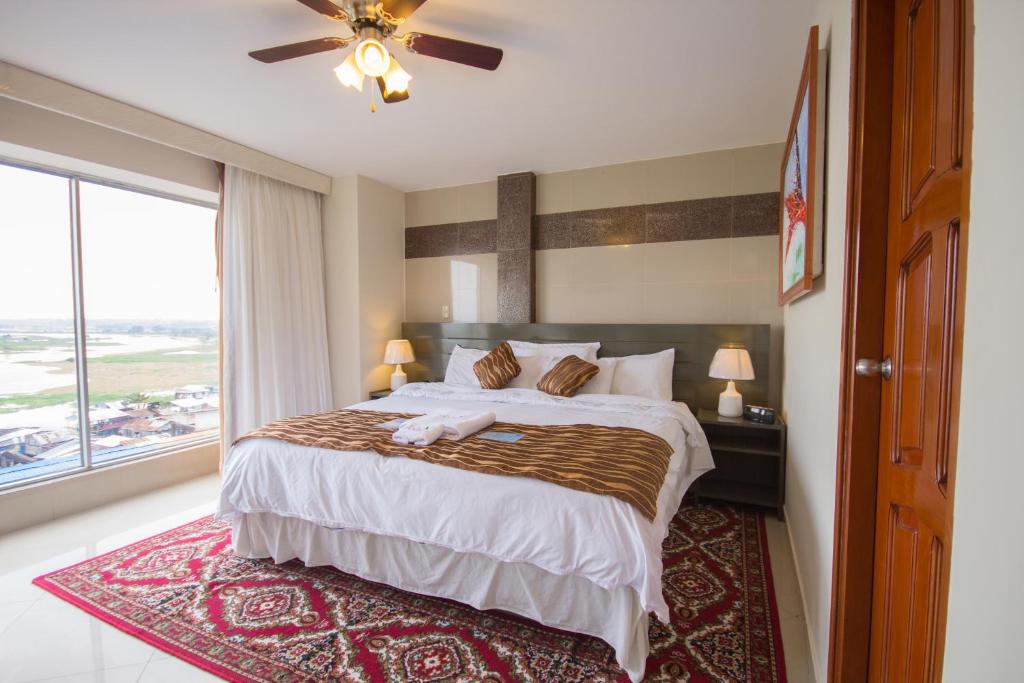 Postel nebo postele na pokoji v ubytování Samiria Jungle Hotel