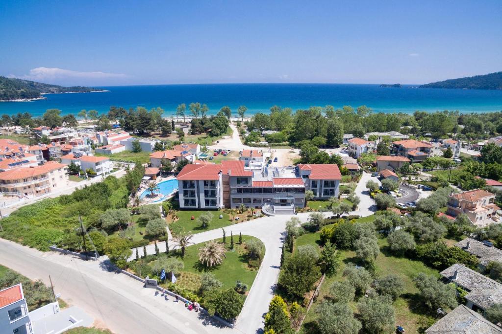 an aerial view of a town with the ocean at Princess Golden Beach Hotel in Chrysi Ammoudia