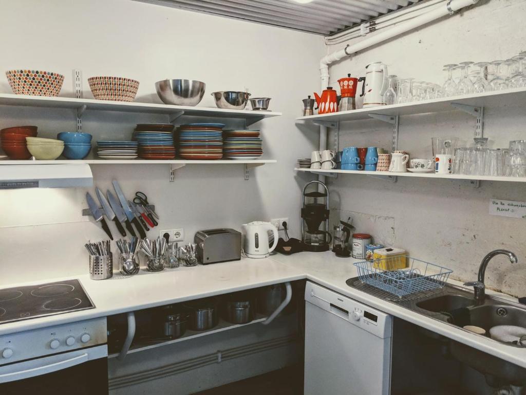 a kitchen with a sink and a counter top at Sjávarborg in Stykkishólmur