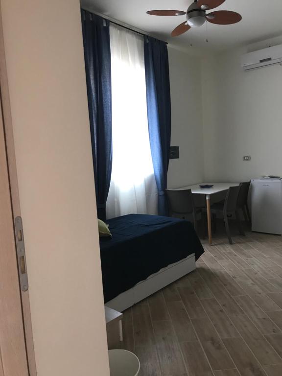Łóżko lub łóżka w pokoju w obiekcie B&B Stella del Mare