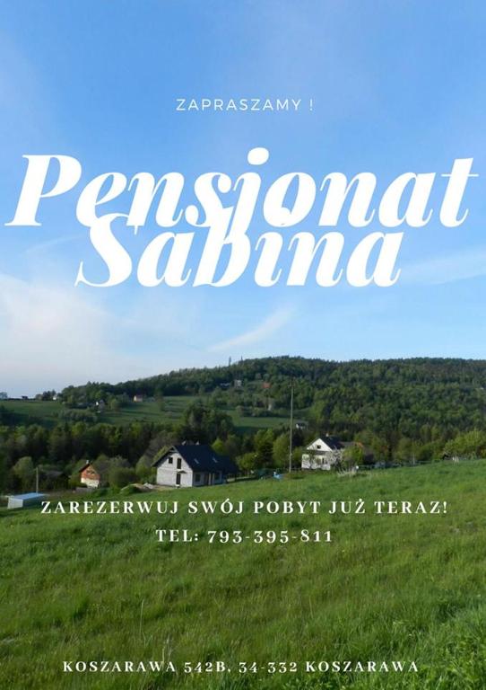 a sign for a park in a grassy field at Pensjonat Sabina in Koszarawa