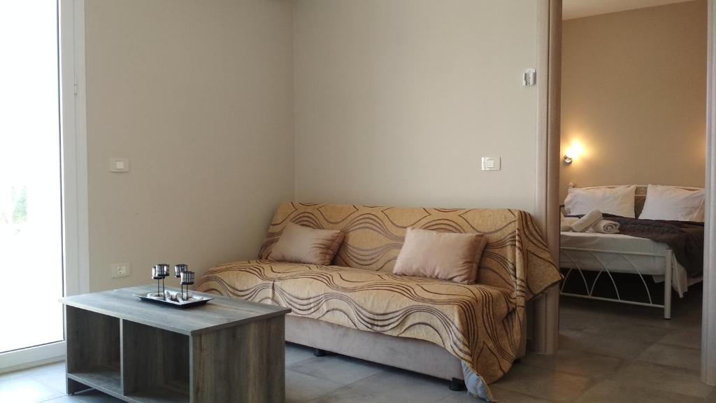 Postel nebo postele na pokoji v ubytování Casa De Rosa Apartments & Studios
