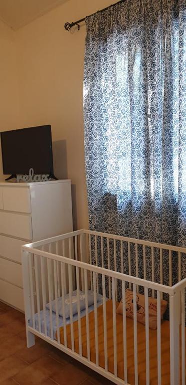 Postel nebo postele na pokoji v ubytování Villa Canella