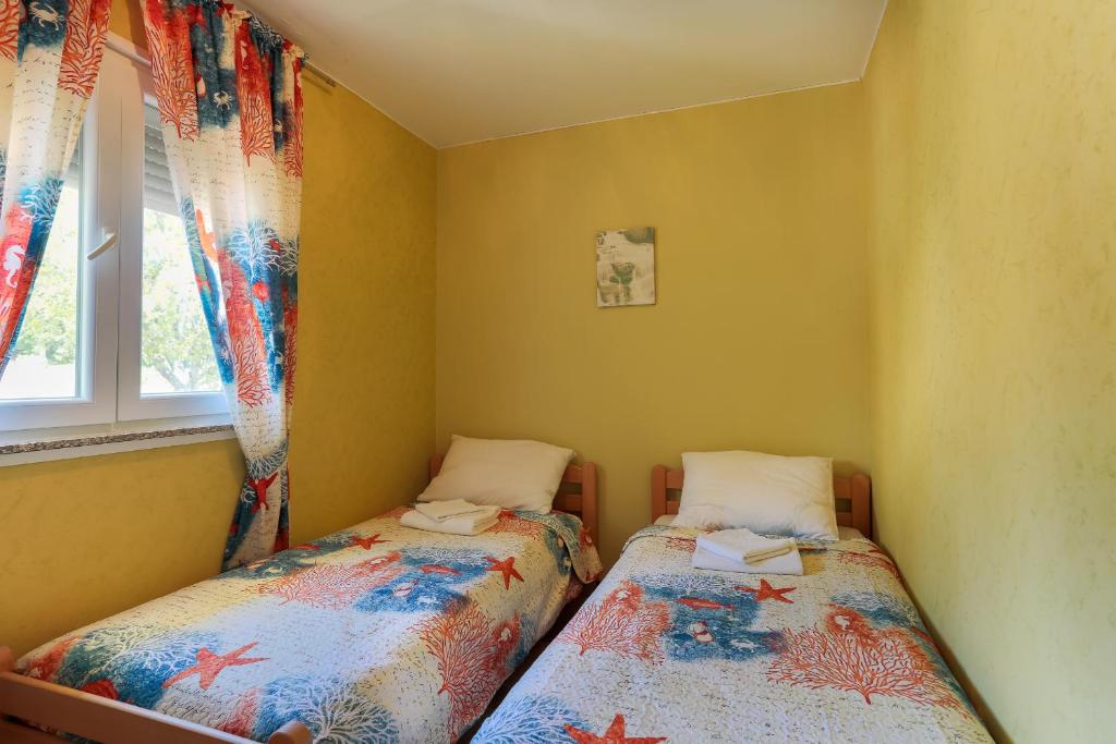 Postel nebo postele na pokoji v ubytování Apartments Dora Victoria Dream