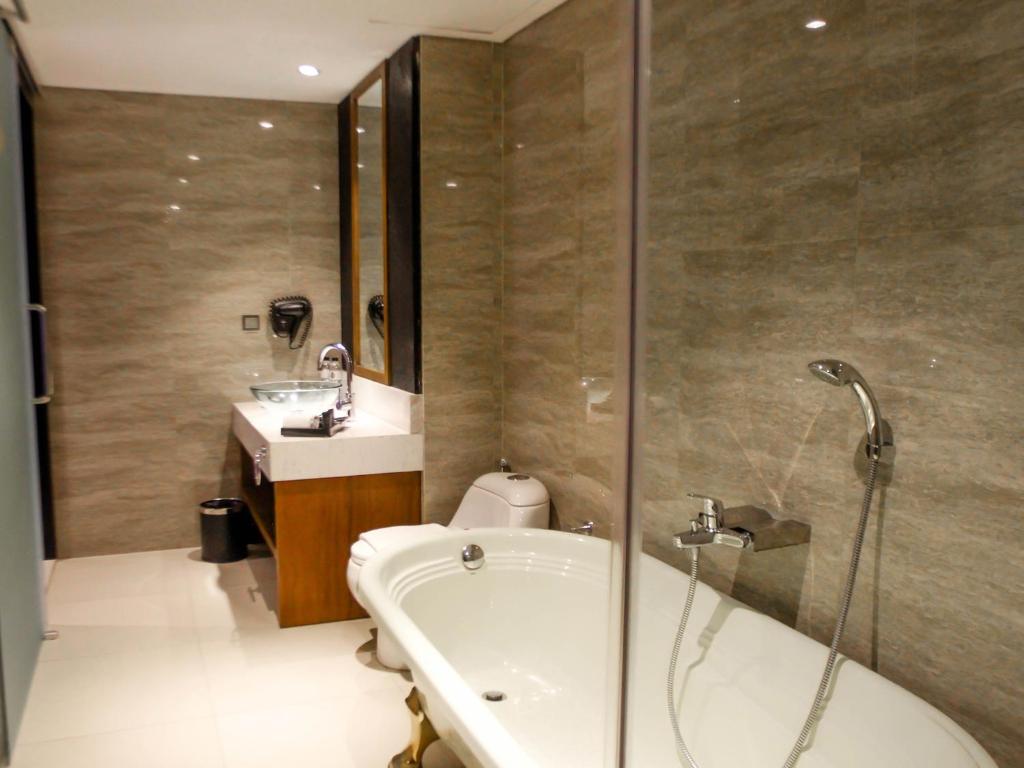 A bathroom at The Nest Hotel Nusa Dua