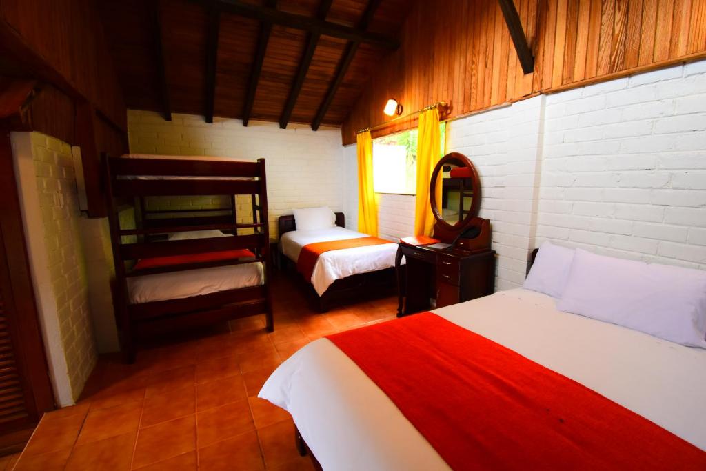 Postel nebo postele na pokoji v ubytování Monte Selva Hotel Spa Termal