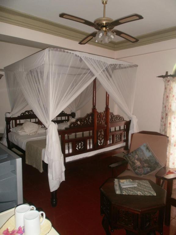 Postel nebo postele na pokoji v ubytování Asmini Palace Hotel