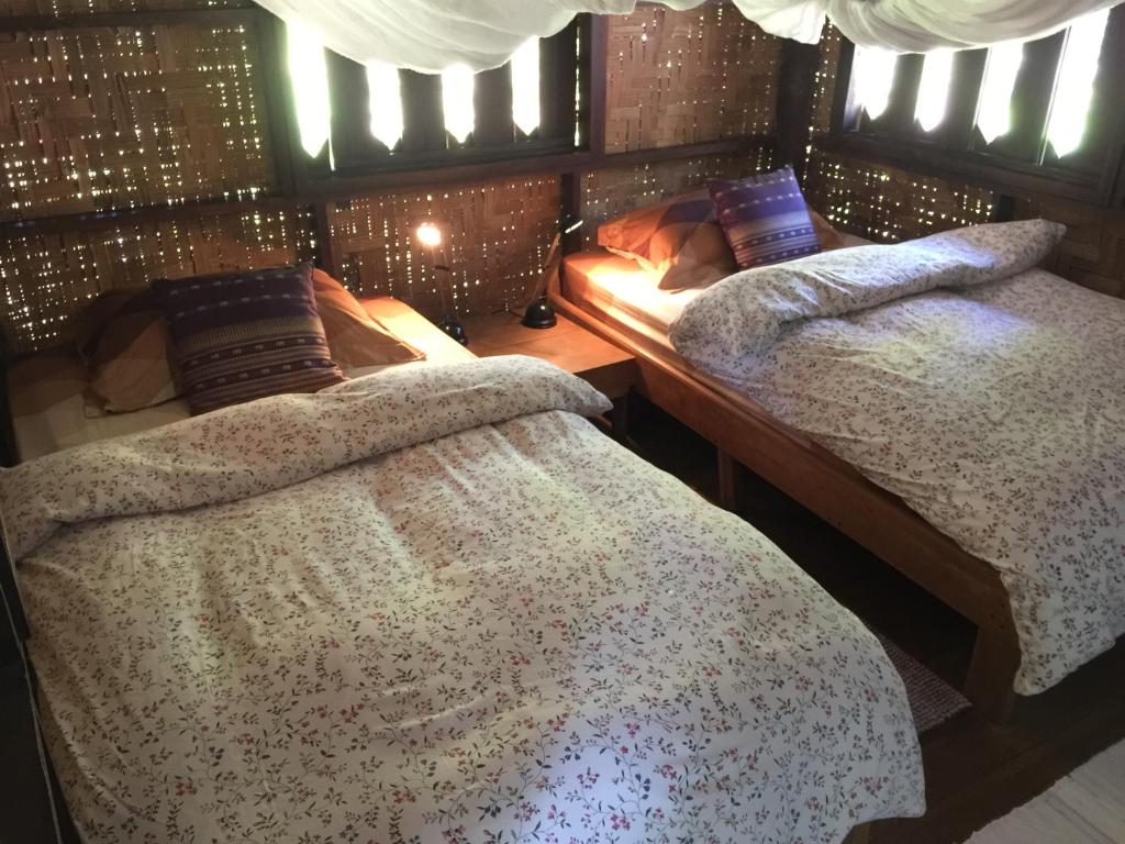 Ein Bett oder Betten in einem Zimmer der Unterkunft Sang Tong Huts