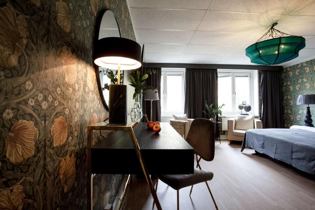 Postel nebo postele na pokoji v ubytování Centric Hotel