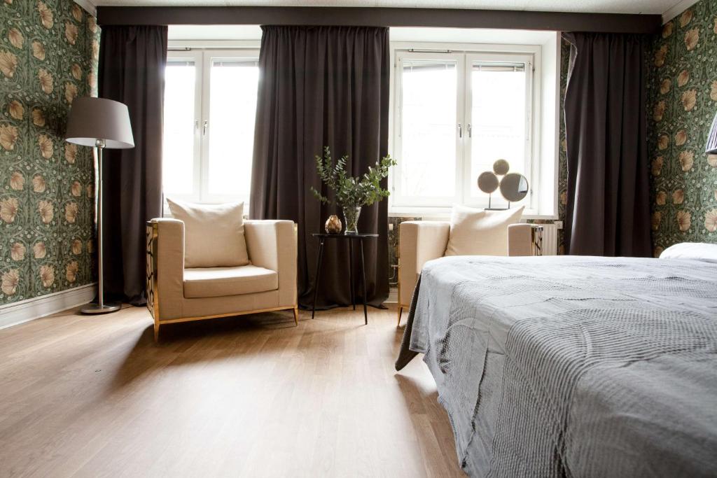 Postel nebo postele na pokoji v ubytování Centric Hotel