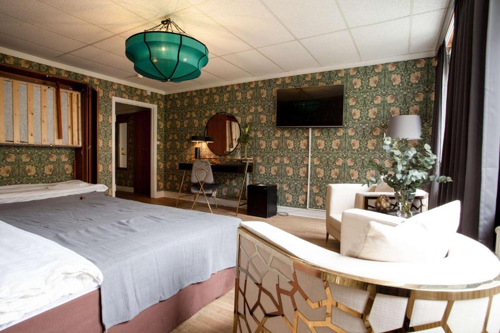 Postel nebo postele na pokoji v ubytování Centric Hotel