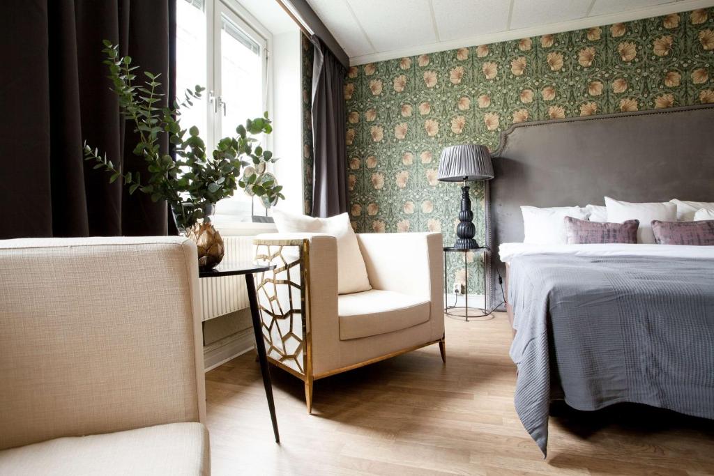 Postel nebo postele na pokoji v ubytování Centric Hotel