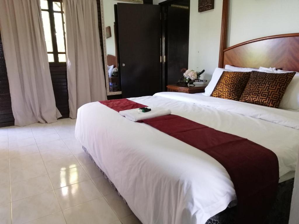 Postel nebo postele na pokoji v ubytování AsiaCamp Taman Negara Resort