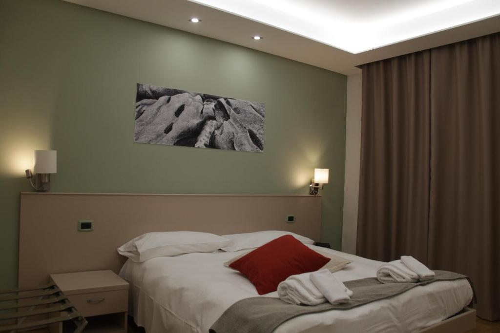 A bed or beds in a room at Albergo Da Benedetta