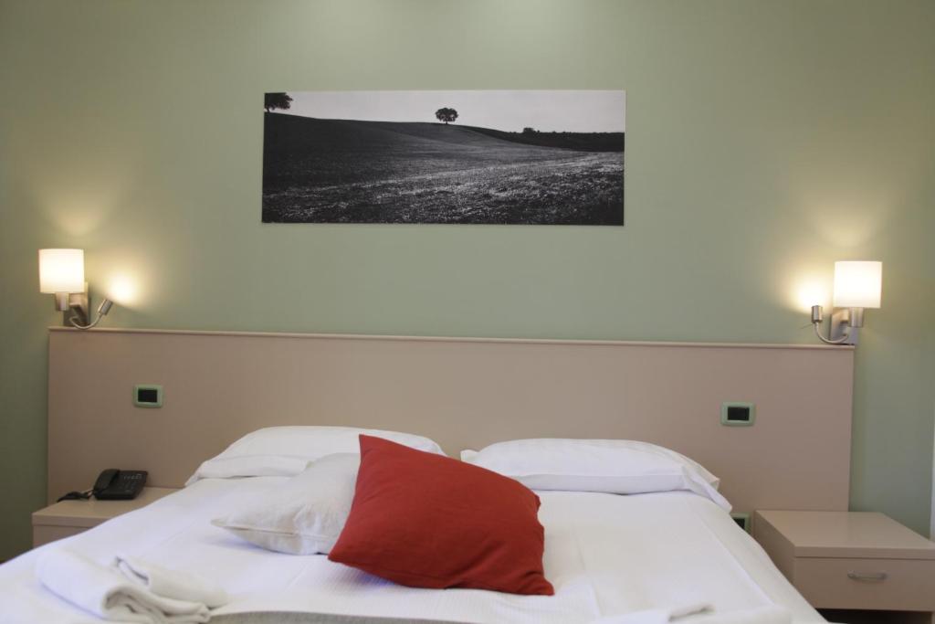 Postel nebo postele na pokoji v ubytování Albergo Da Benedetta