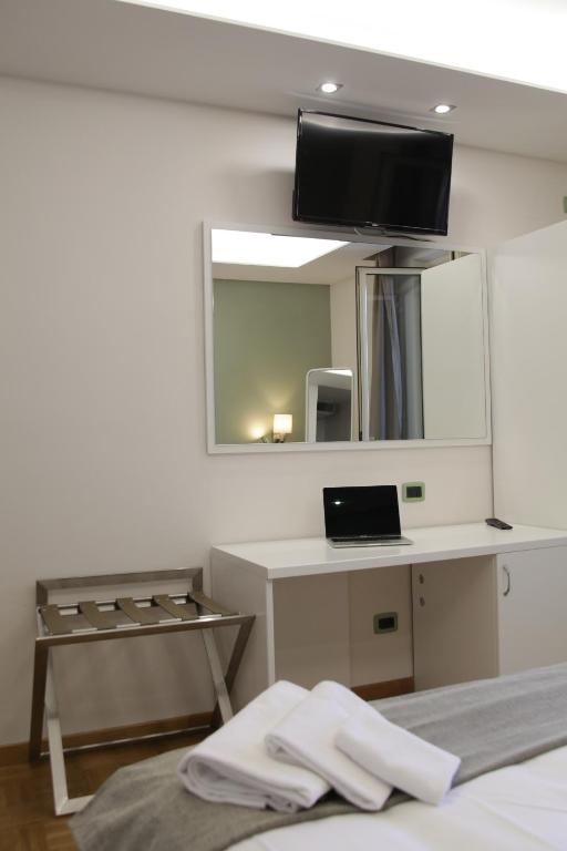TV a/nebo společenská místnost v ubytování Albergo Da Benedetta