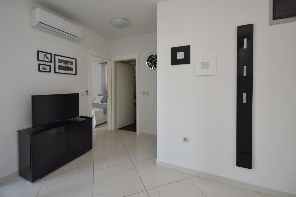 TV a/nebo společenská místnost v ubytování Brunchi apartment Novalja