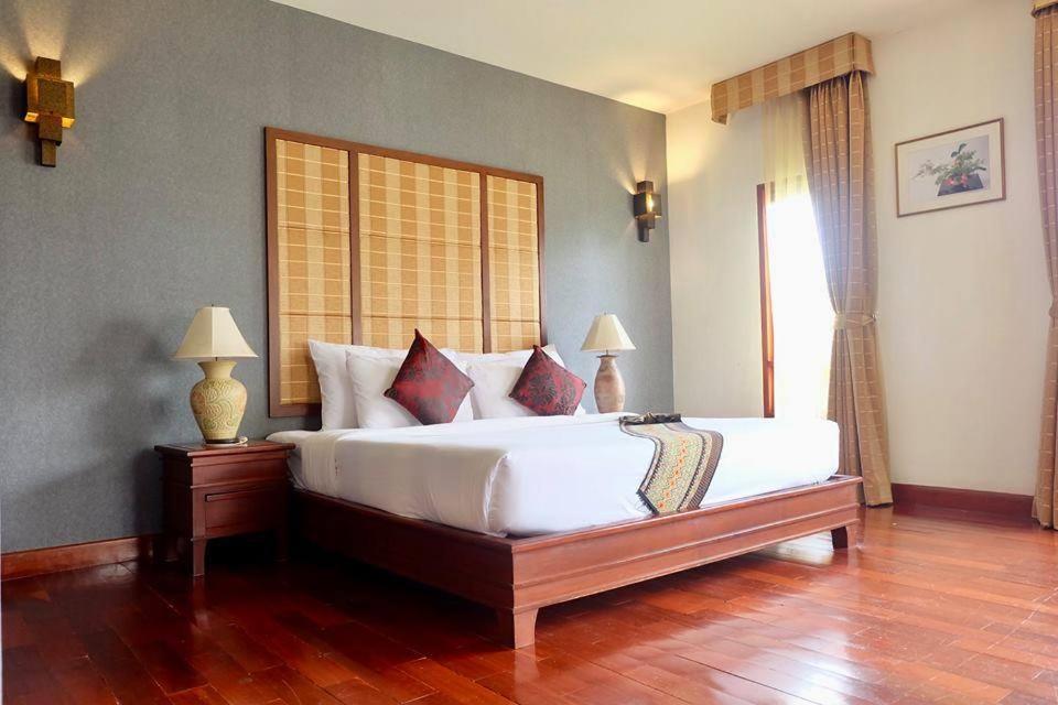 Postel nebo postele na pokoji v ubytování Teak Garden Resort, Chiang Rai