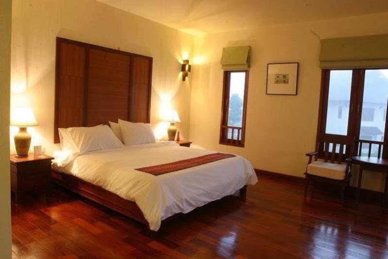 Postel nebo postele na pokoji v ubytování Teak Garden Resort, Chiang Rai