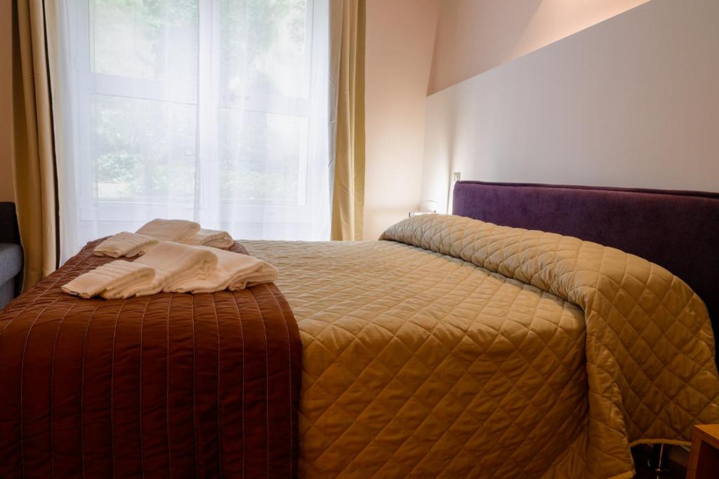 Postel nebo postele na pokoji v ubytování Bed&Book