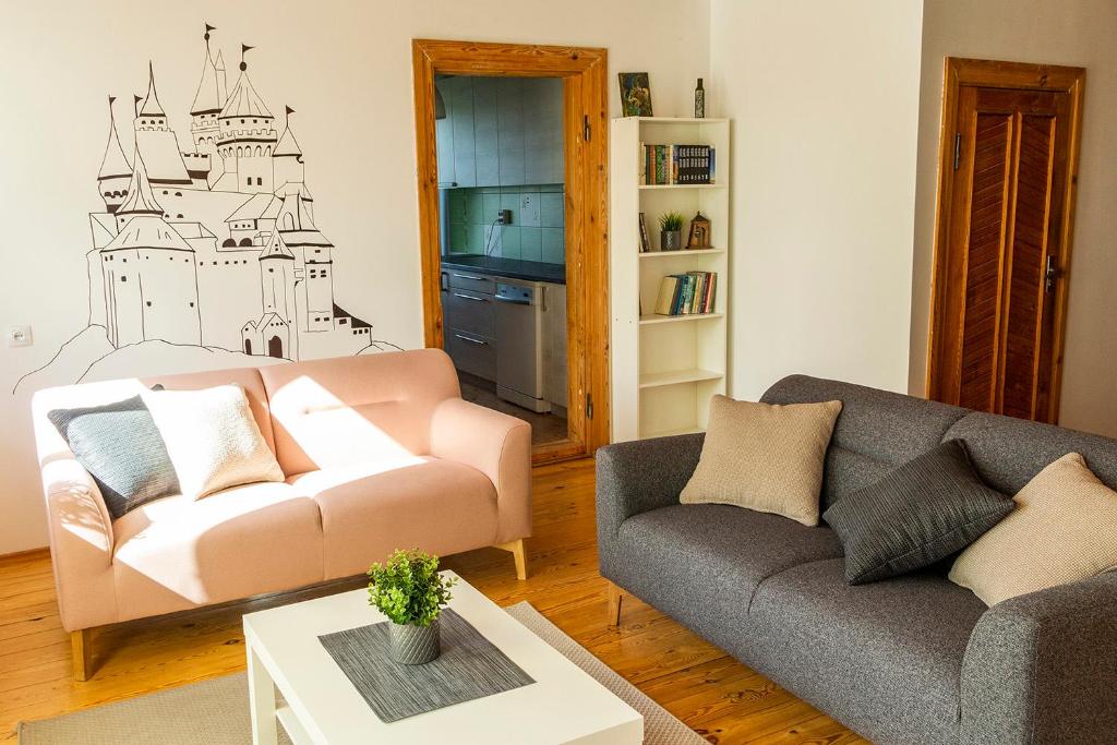 a living room with a couch and a table at At the Trakai Castle in Trakai