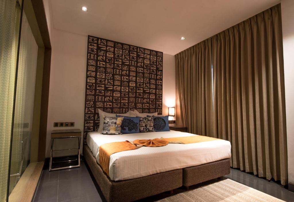 Postel nebo postele na pokoji v ubytování Hotel Gallery 67