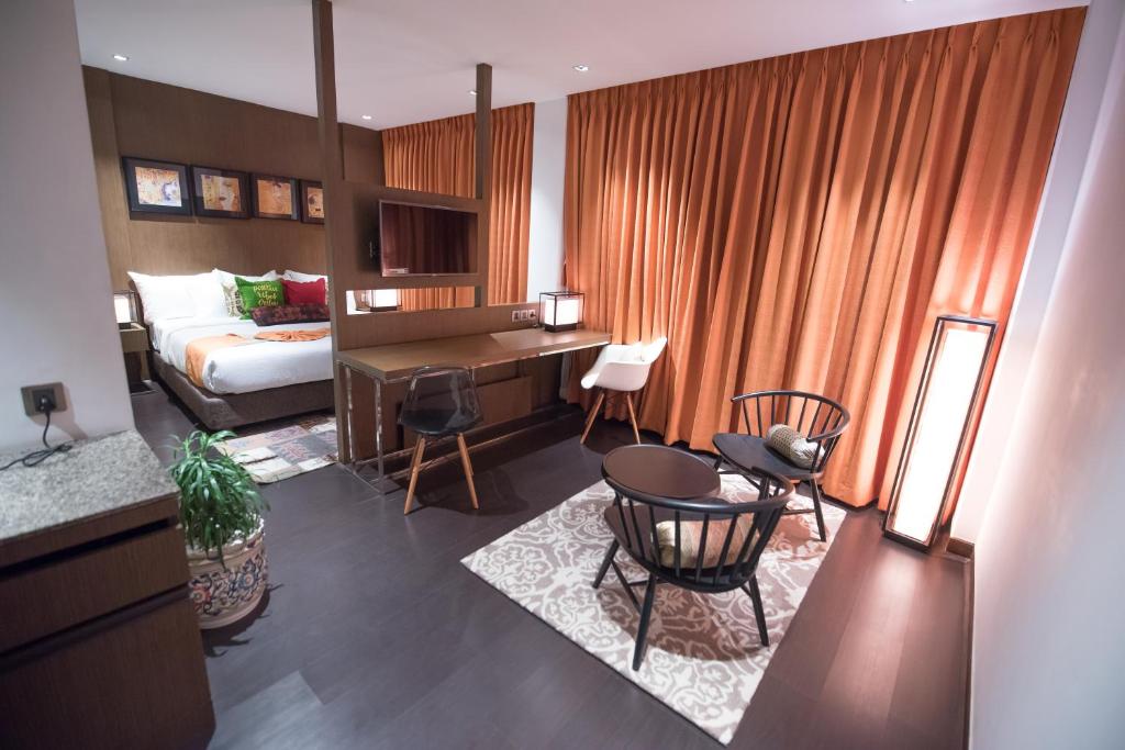 Postel nebo postele na pokoji v ubytování Hotel Gallery 67