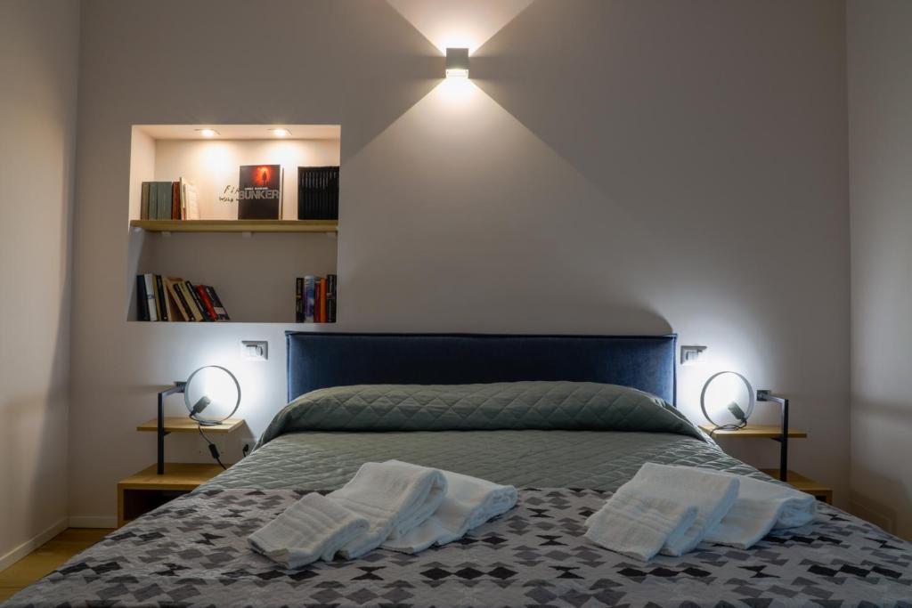 Postel nebo postele na pokoji v ubytování Bed&Book