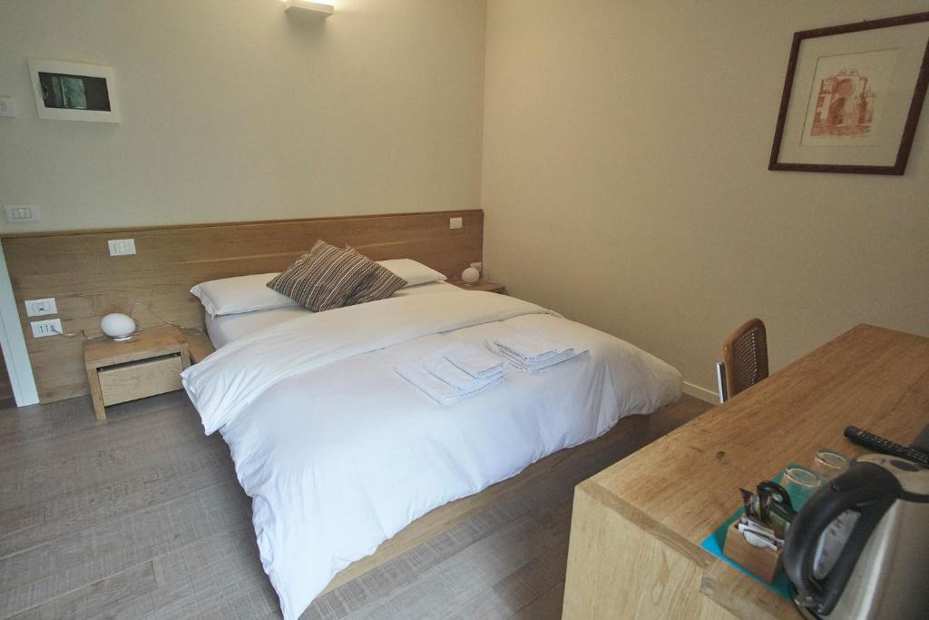 Postel nebo postele na pokoji v ubytování Agriturismo CasaMela
